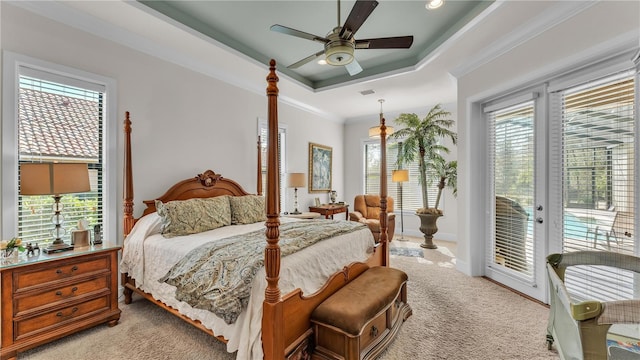 carpeted bedroom featuring a raised ceiling, crown molding, access to exterior, and ceiling fan