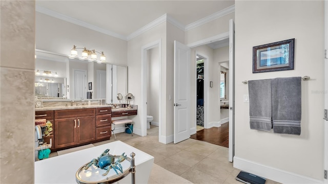 bathroom featuring crown molding, tile patterned floors, toilet, and vanity