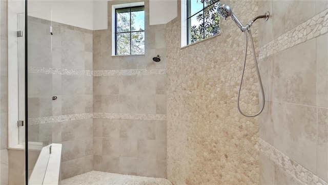 bathroom featuring a tile shower