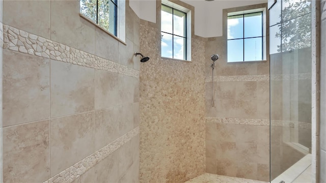 bathroom with a tile shower