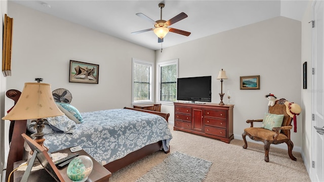 carpeted bedroom featuring lofted ceiling and ceiling fan