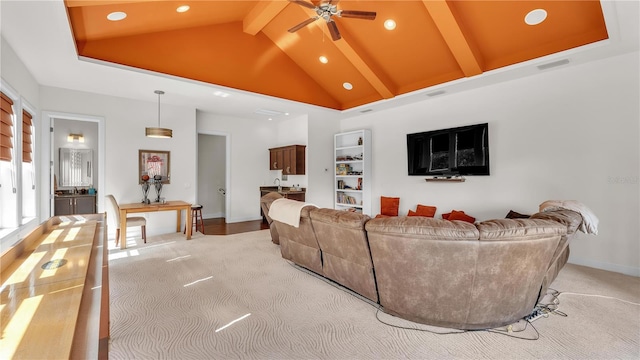 carpeted living room with ceiling fan, high vaulted ceiling, and beam ceiling