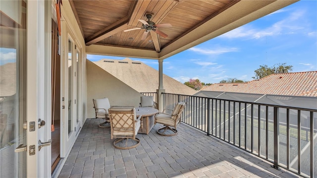 exterior space with ceiling fan and a balcony