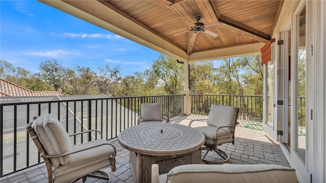 exterior space featuring ceiling fan