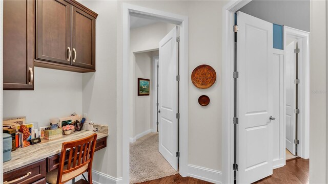 corridor featuring hardwood / wood-style flooring