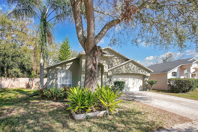 view of front facade with a garage and a front lawn