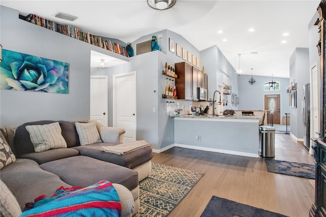 living room featuring dark hardwood / wood-style flooring and a high ceiling