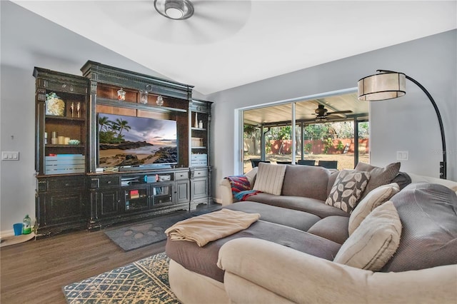 living room featuring dark wood-type flooring and ceiling fan