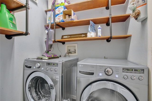 washroom featuring washing machine and clothes dryer