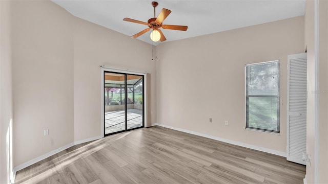 unfurnished room with ceiling fan and light wood-type flooring