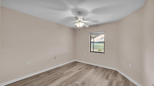 unfurnished room featuring a textured ceiling, ceiling fan, and light wood-type flooring