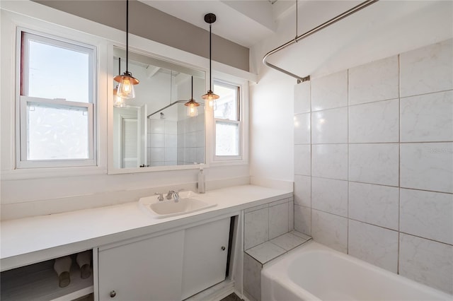 bathroom with vanity and shower / washtub combination