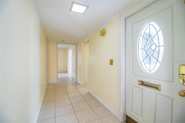 foyer entrance with light tile patterned flooring