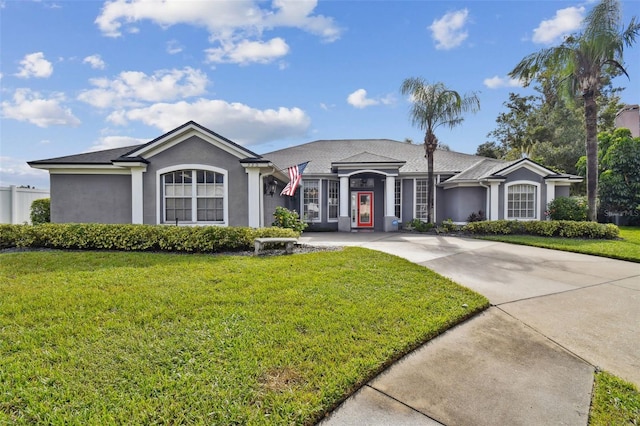 ranch-style house with a front lawn