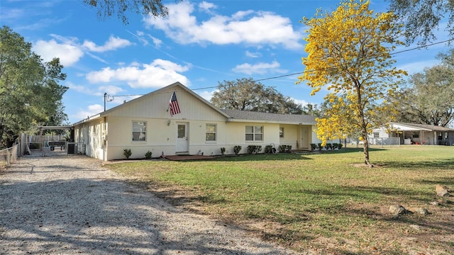 single story home with fence and a front lawn