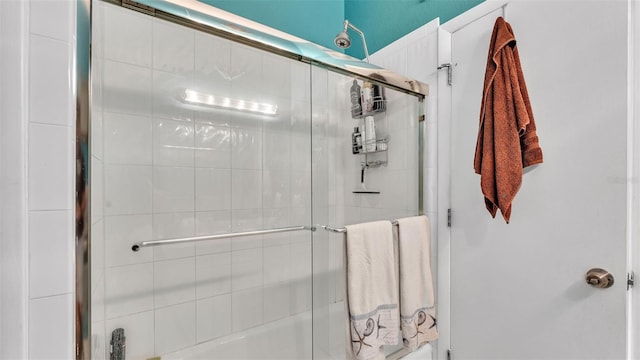 bathroom with tiled shower