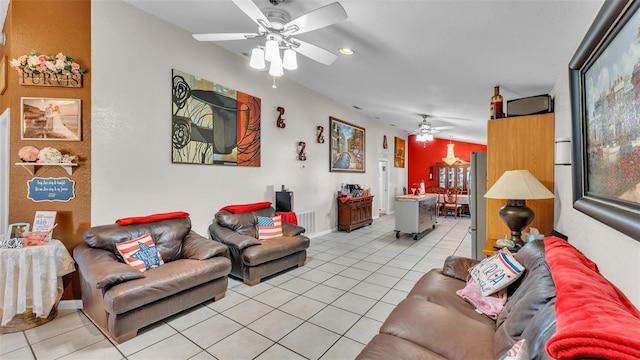 living area with ceiling fan, visible vents, and light tile patterned flooring