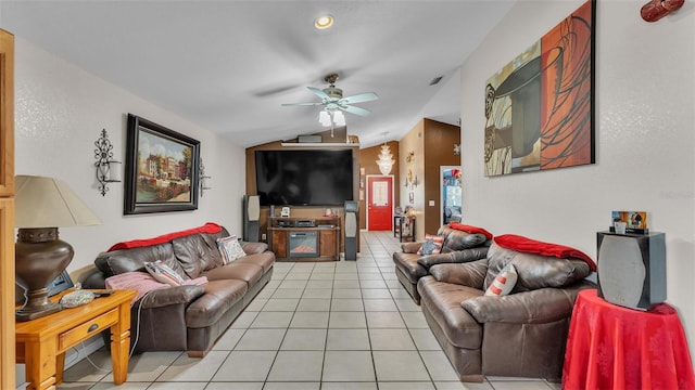 living area featuring light tile patterned floors, visible vents, lofted ceiling, and a ceiling fan