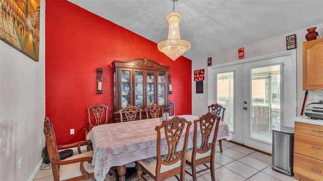 dining room with french doors, light tile patterned floors, an inviting chandelier, vaulted ceiling, and baseboards