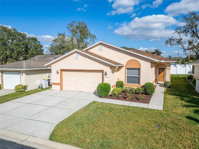 ranch-style home with a garage and a front yard