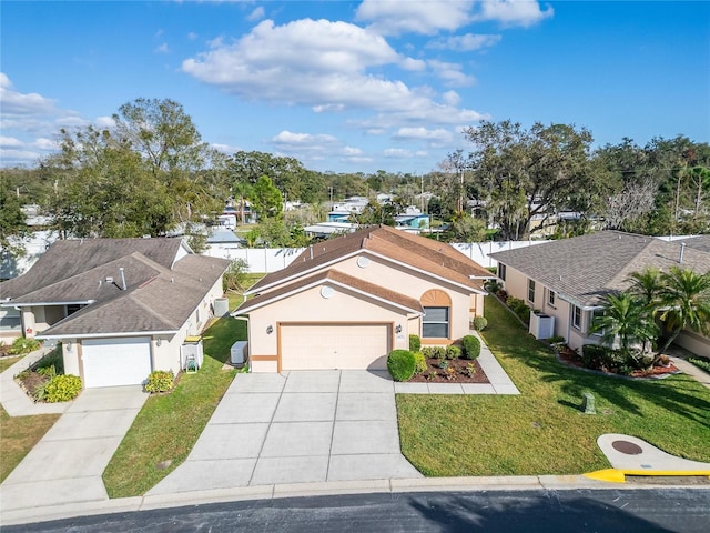 view of front of house with a garage and a front yard