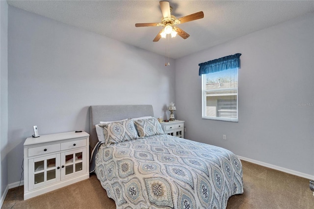 carpeted bedroom with a textured ceiling and ceiling fan