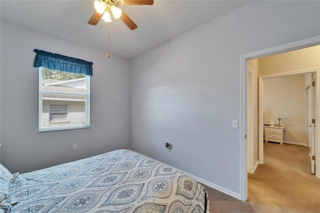 bedroom with light colored carpet and ceiling fan