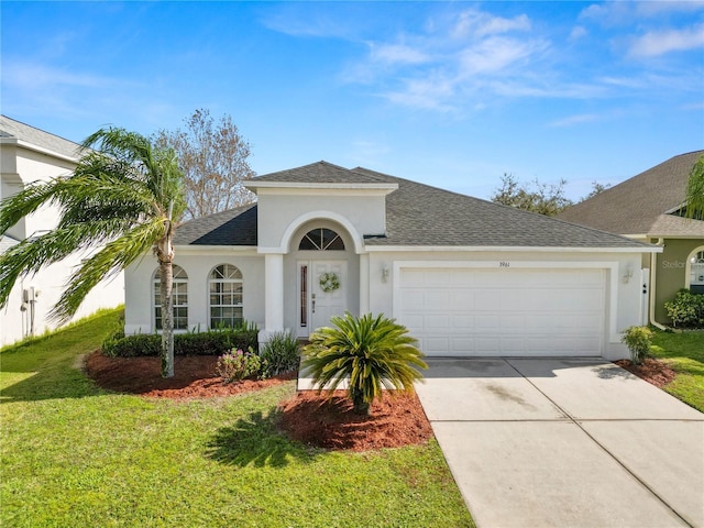 view of front of home featuring a garage and a front yard