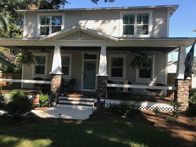 view of front of home featuring ceiling fan and a porch