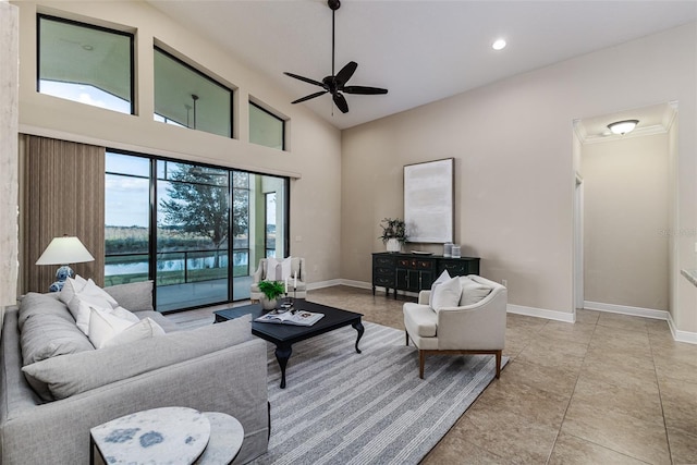 tiled living room featuring high vaulted ceiling and ceiling fan