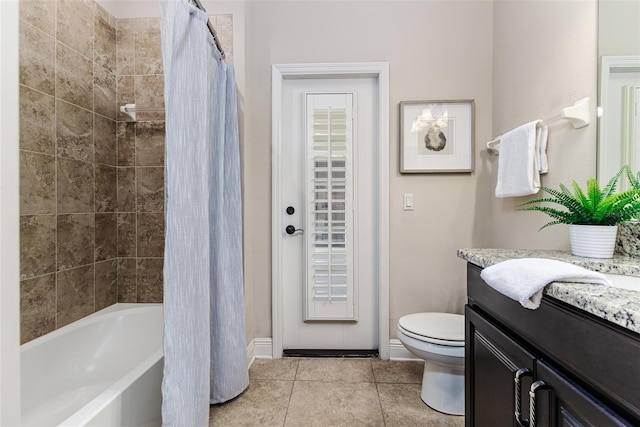 full bathroom with tile patterned flooring, vanity, shower / bath combo, and toilet