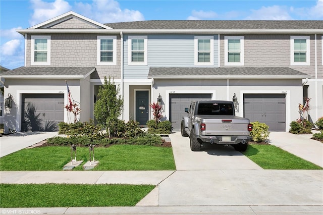 view of front of house featuring a garage and a front yard