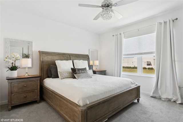 bedroom with light colored carpet and ceiling fan