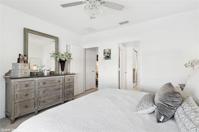 bedroom featuring ceiling fan and ensuite bath