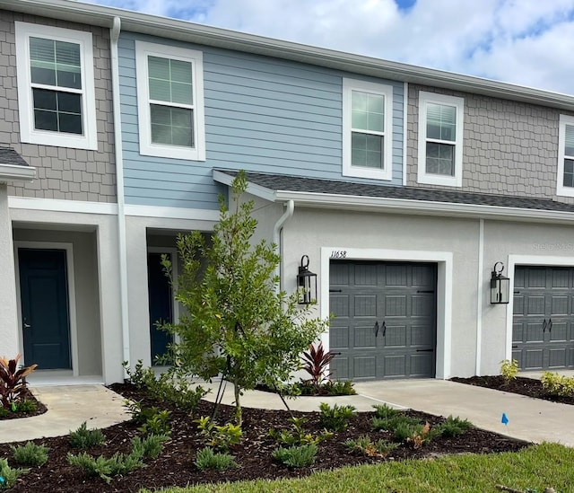 11658 Bluestone Ct, Parrish, FL 34219 - view of front of home featuring a garage and stucco siding