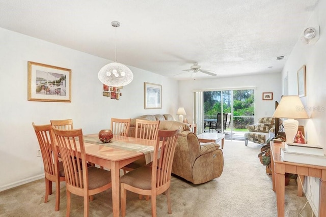 view of carpeted dining area