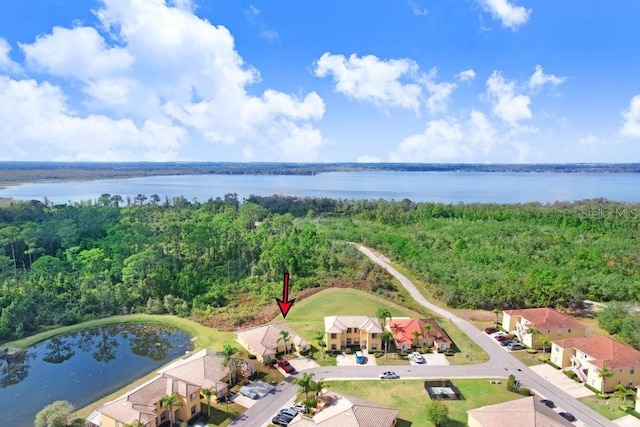 birds eye view of property featuring a water view