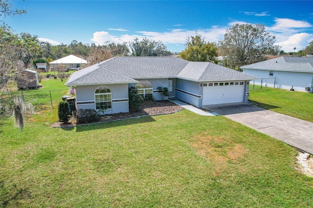 single story home with a garage and a front lawn