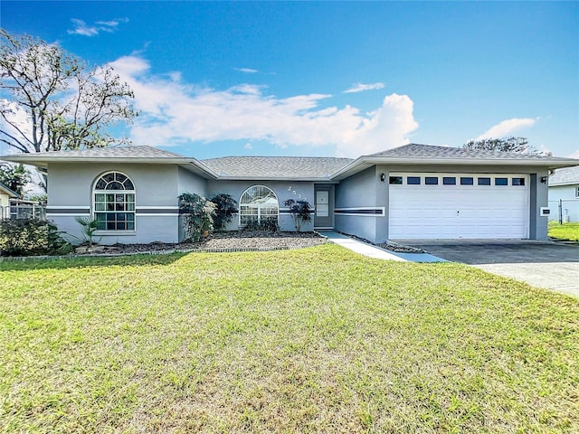 ranch-style house featuring a garage and a front yard