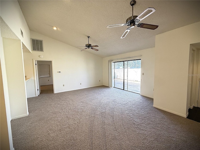 carpeted spare room featuring vaulted ceiling, ceiling fan, and a textured ceiling