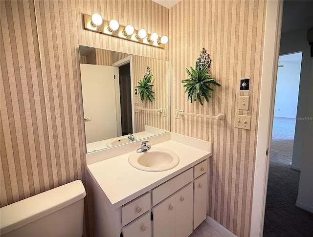 bathroom with vanity and toilet