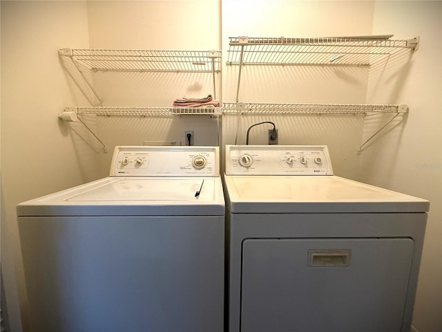 washroom featuring separate washer and dryer