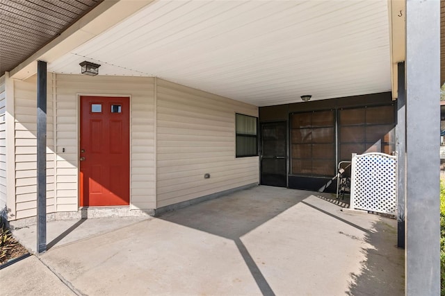 entrance to property with a carport