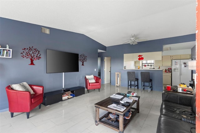 living room featuring lofted ceiling and ceiling fan