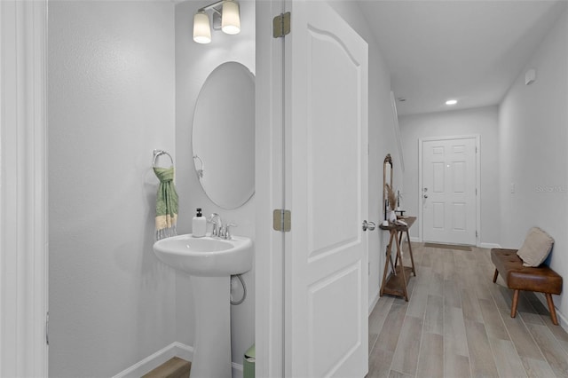 bathroom featuring wood-type flooring