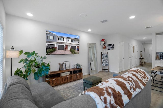 living room with light hardwood / wood-style floors