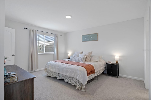 bedroom featuring light carpet