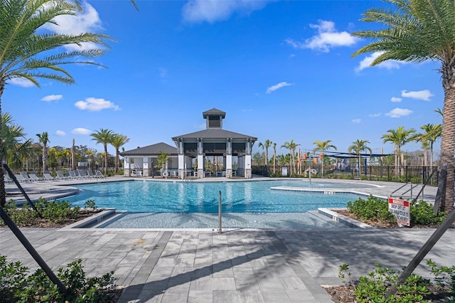 view of swimming pool with a gazebo and a patio