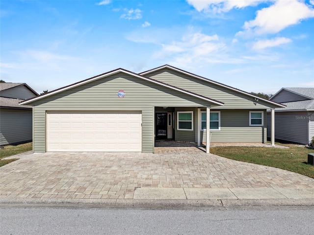 single story home featuring a garage