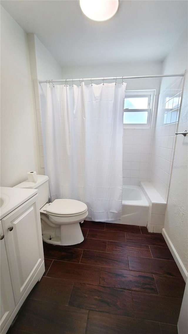 full bathroom featuring shower / tub combo, vanity, and toilet